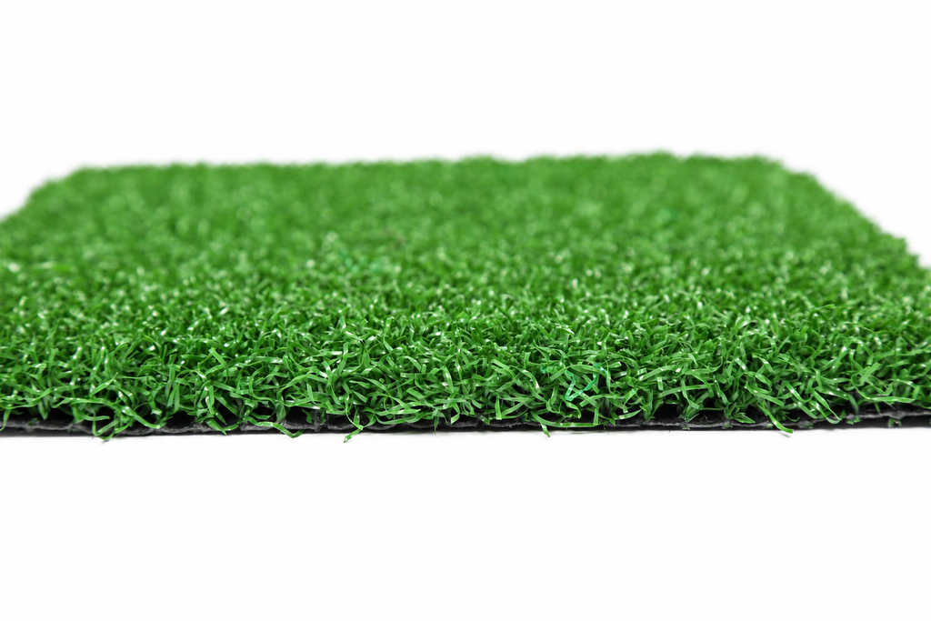 Golf putting green turf sample showing short curled pile and cut edge