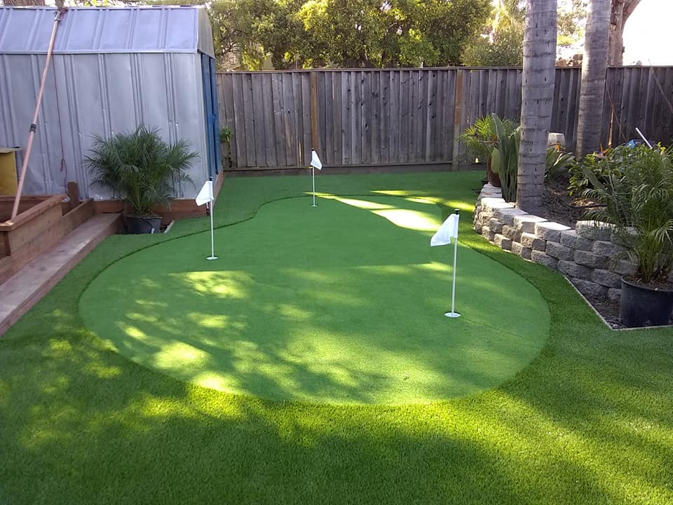 Practice putting green with golf artificial grass in a garden
