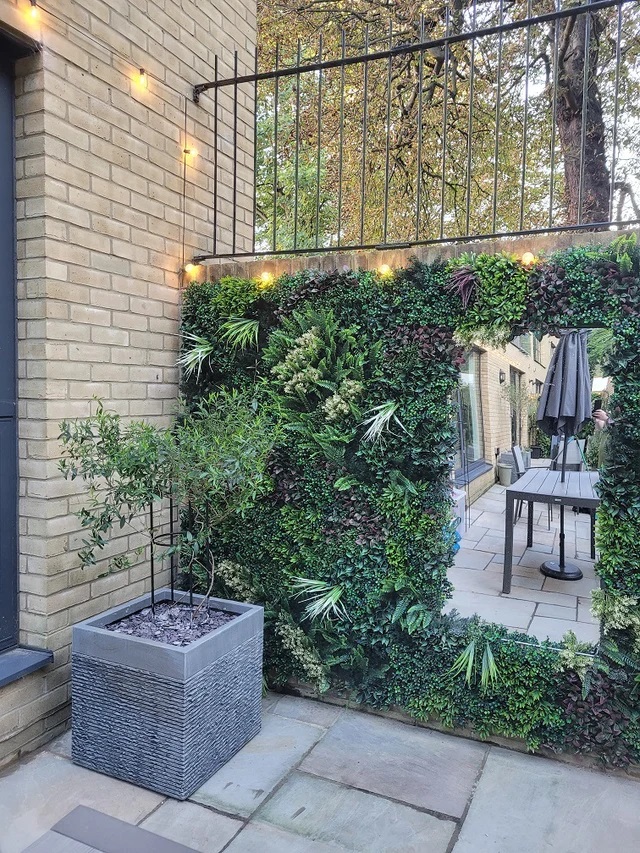 Artificial plant wall on building facades and fences